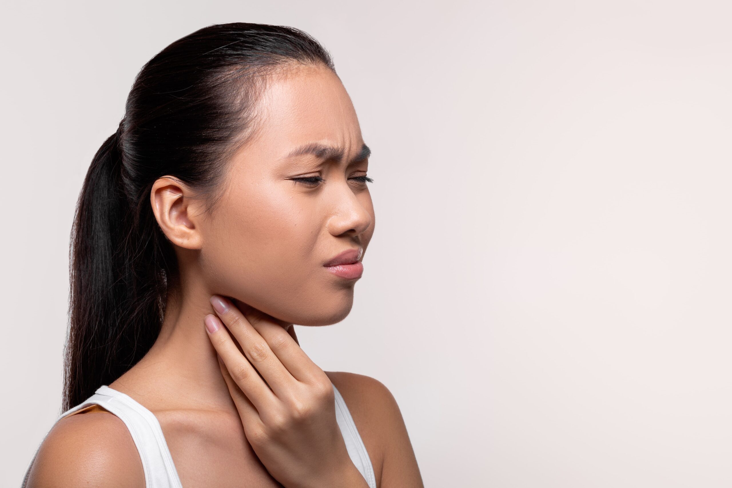 Image asian woman suffering from sore throat touching h 2025 03 18 17 37 08 utc