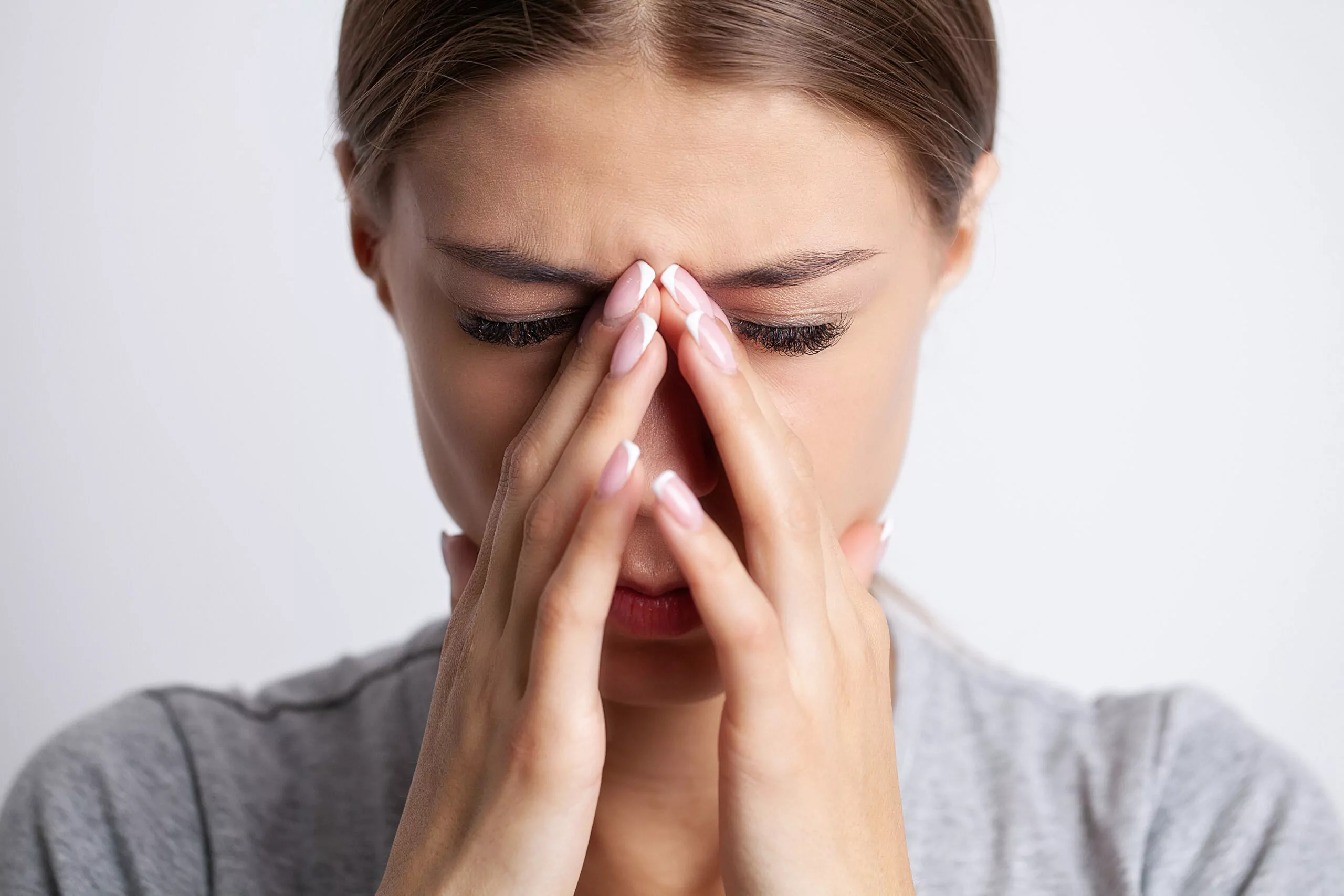 Woman sneezing, allergic rhinitis care at ENT specialist clinic