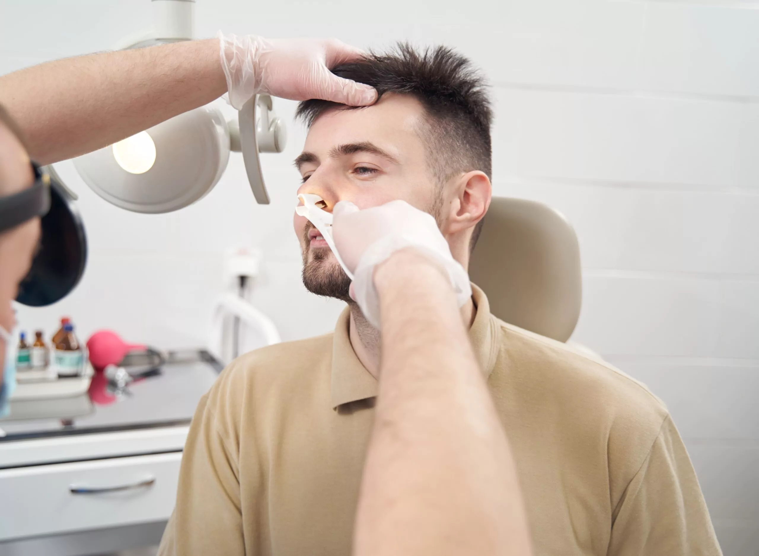 Dr. Gan performing nasal examination procedure/Diagnosis of Deviated Septum